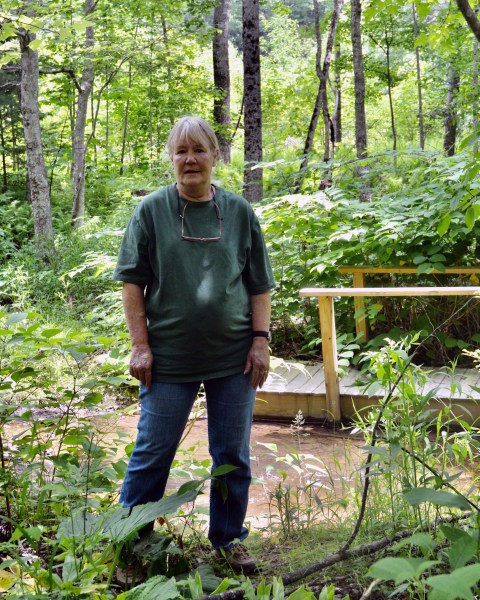 Red Terry stands in front of her 2018 tree-sitting site at Bottom Creek on Terry property in Roanoke County. The scarlet oak and maple that held her aloft are long gone. 