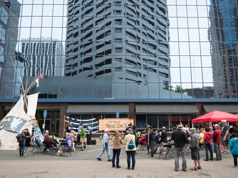 A group of protesters opposing the Line 3 oil pipeline gathered outside the Minnesota Public Utility Commission in May 2018.