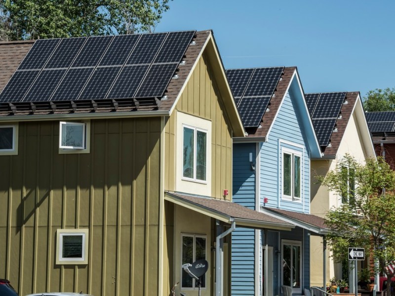 A line of houses with rooftop solar.