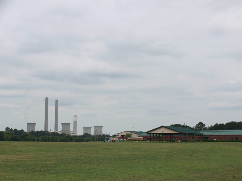 Plant Bowen’s cooling towers visible two miles behind Taylorsville Elementary School, in Stilesboro, Georgia. Plant Bowen is the proposed site of the largest beneficial reuse project of coal ash in the country.