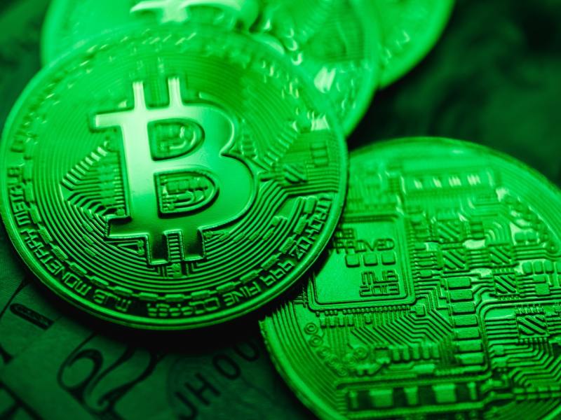 Bitcoin on a green background.