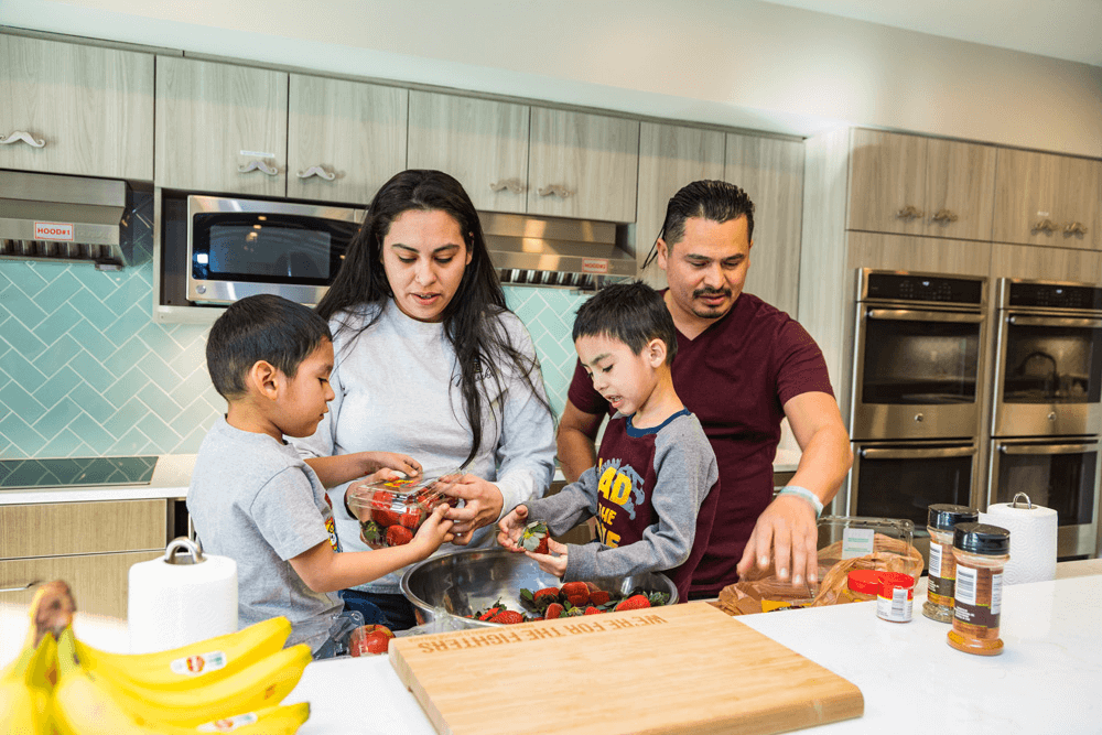 Family using kitchen at Ronald McDonald House Charities in Omaha